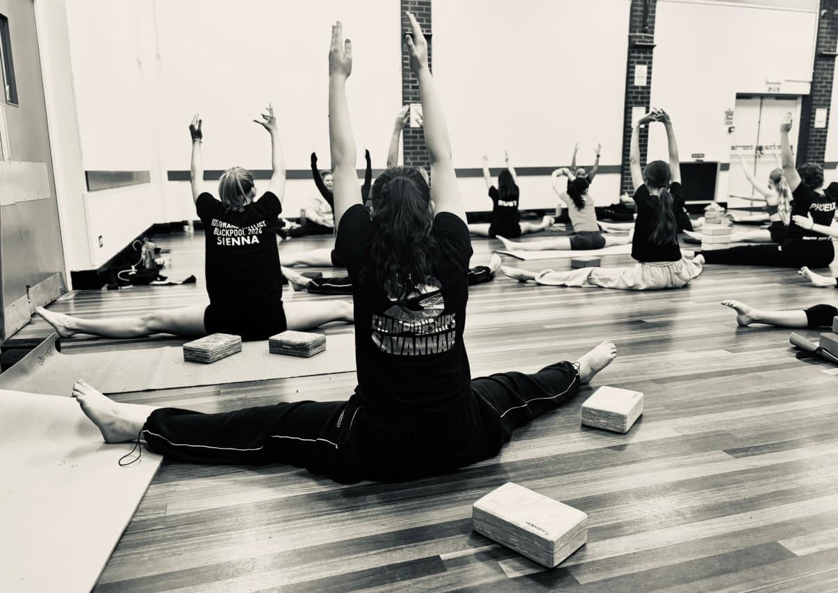 Dancers stretching in Technique, Stretch and Conditioning class